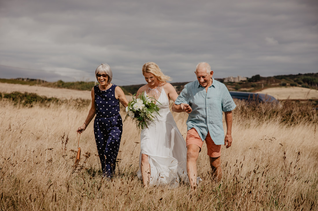 Jen & Nick's Festival Styled Clifftop Wedding at Compton Beach - Holly Cade - Alternative Candid Documentary Wedding & Portrait Photographer. Available to shoot on the Isle of Wight, Portsmouth, Southampton, Hampshire, the South Coast of England, throughout the UK and Worldwide.