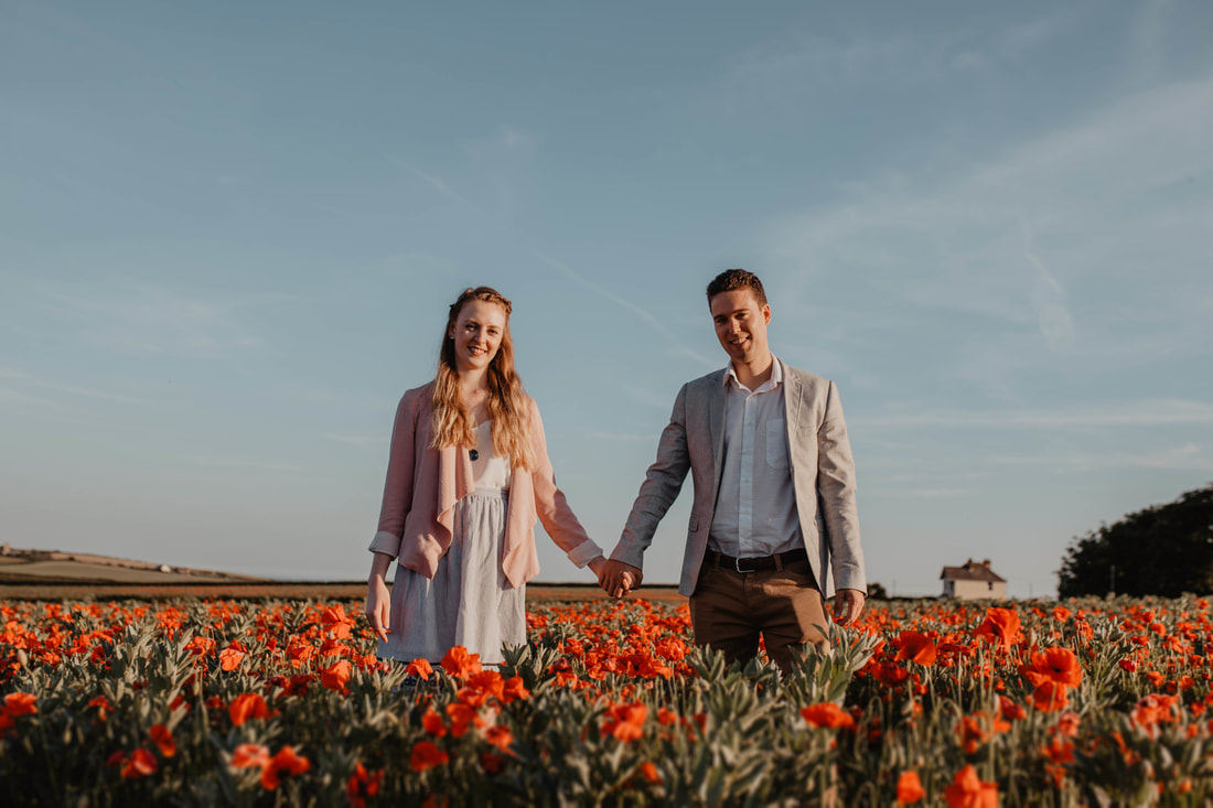 Rachel & Ryan's Pre-Wedding Shoot in the Poppy Field in Chale by Holly Cade - Alternative Documentary Wedding & Portrait Photographer. Available to shoot on the Isle of Wight, South Coast of England, throughout the UK and Worldwide.