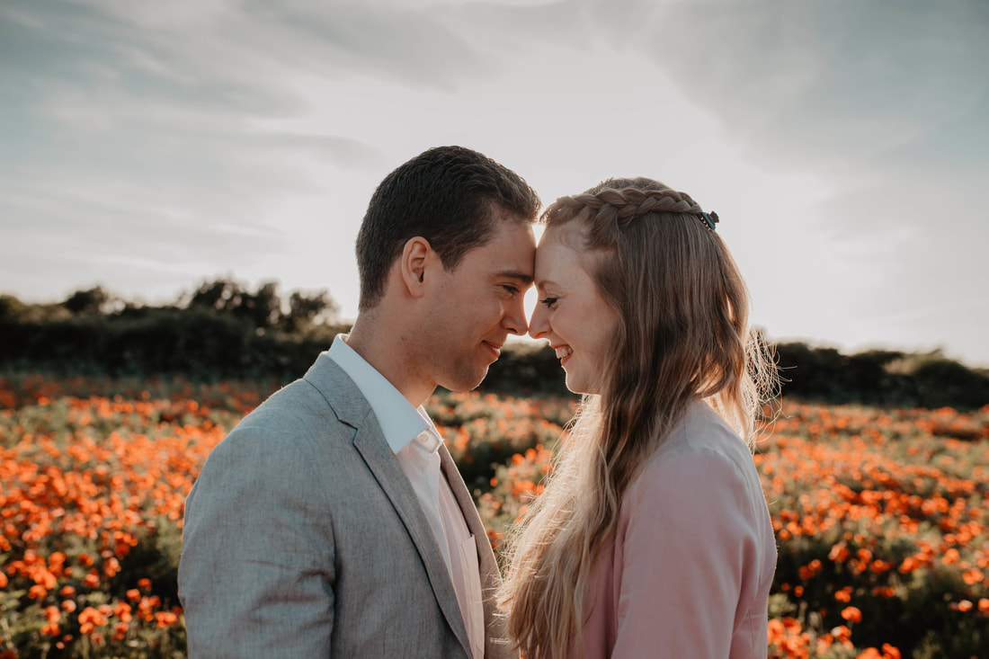Rachel & Ryan's Pre-Wedding Shoot in the Poppy Field in Chale by Holly Cade - Alternative Documentary Wedding & Portrait Photographer. Available to shoot on the Isle of Wight, South Coast of England, throughout the UK and Worldwide.